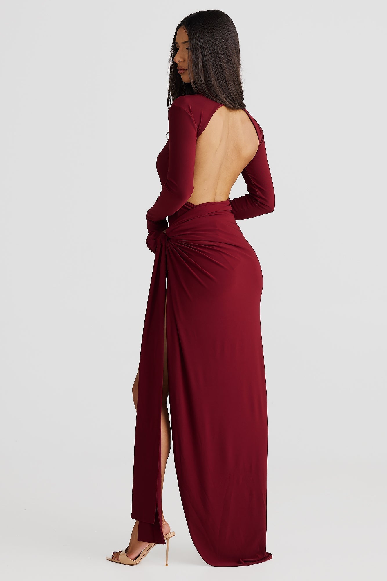 "Lira Öppen Rygg Klänning" could be rewritten as "Lira Klänning med Öppen Rygg".